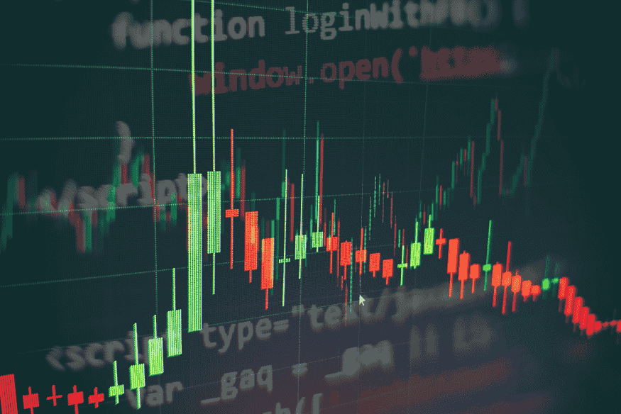 Trading chart on a digital screen representing market movement, price fluctuations, and the differences between ETFs and index funds