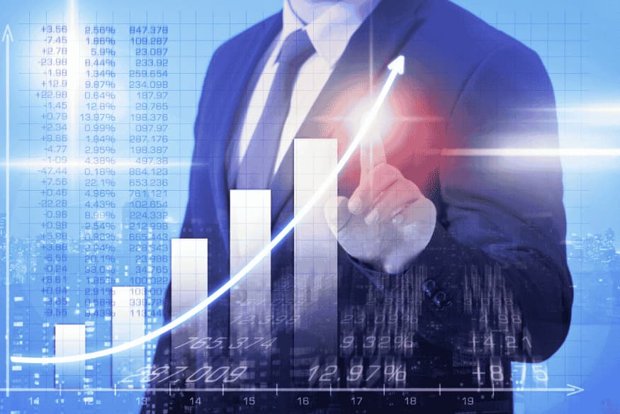 Business person pointing at rising bar chart symbolizing reaching and surpassing the personal financial break-even point