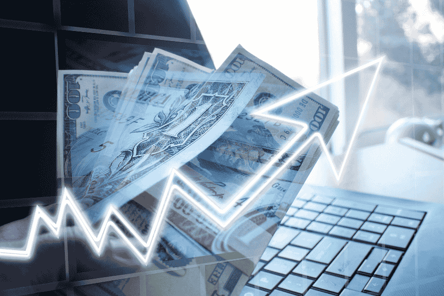 Dollar bills and rising line graph over laptop representing managing irregular income with digital tools
