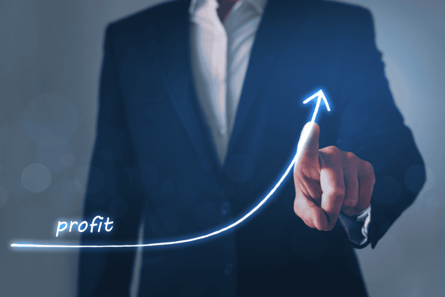 Business owner pointing at an upward profit curve representing the Profit First method