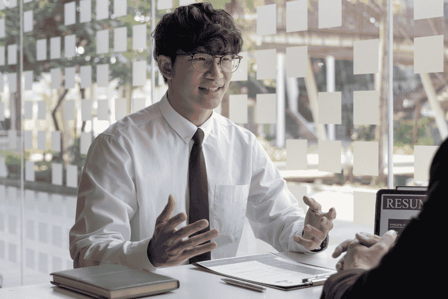 Student discussing financial goals and student credit card options during a meeting